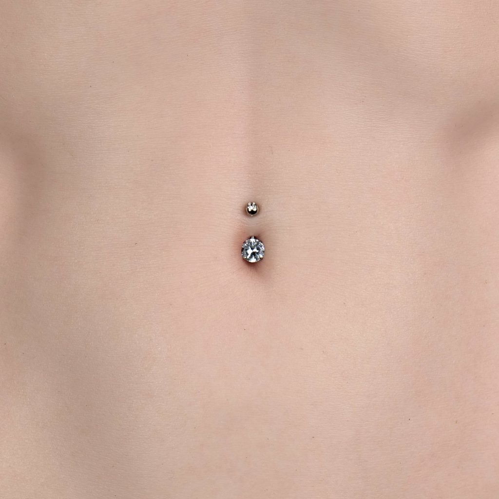 Diamond-Belly-Button-Rings-on-a-Sex-Doll-with-Belly-Piercing.jpg